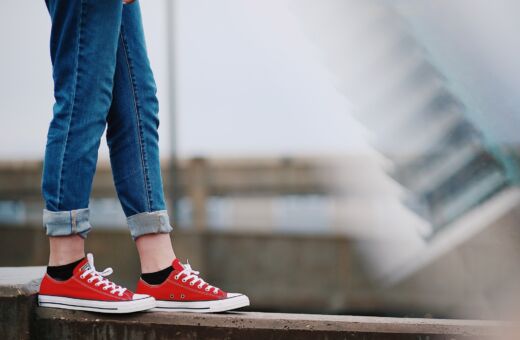 A young person in red trainers stepping up — the transition to secondary school is a tipping point for many learners with FASD